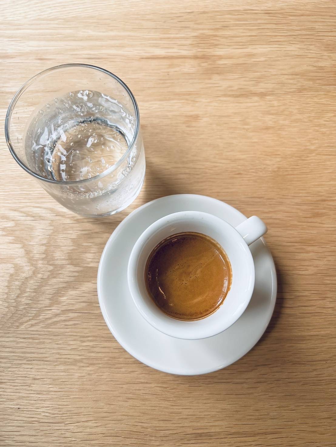 Espresso with sparkling water on a wooden table